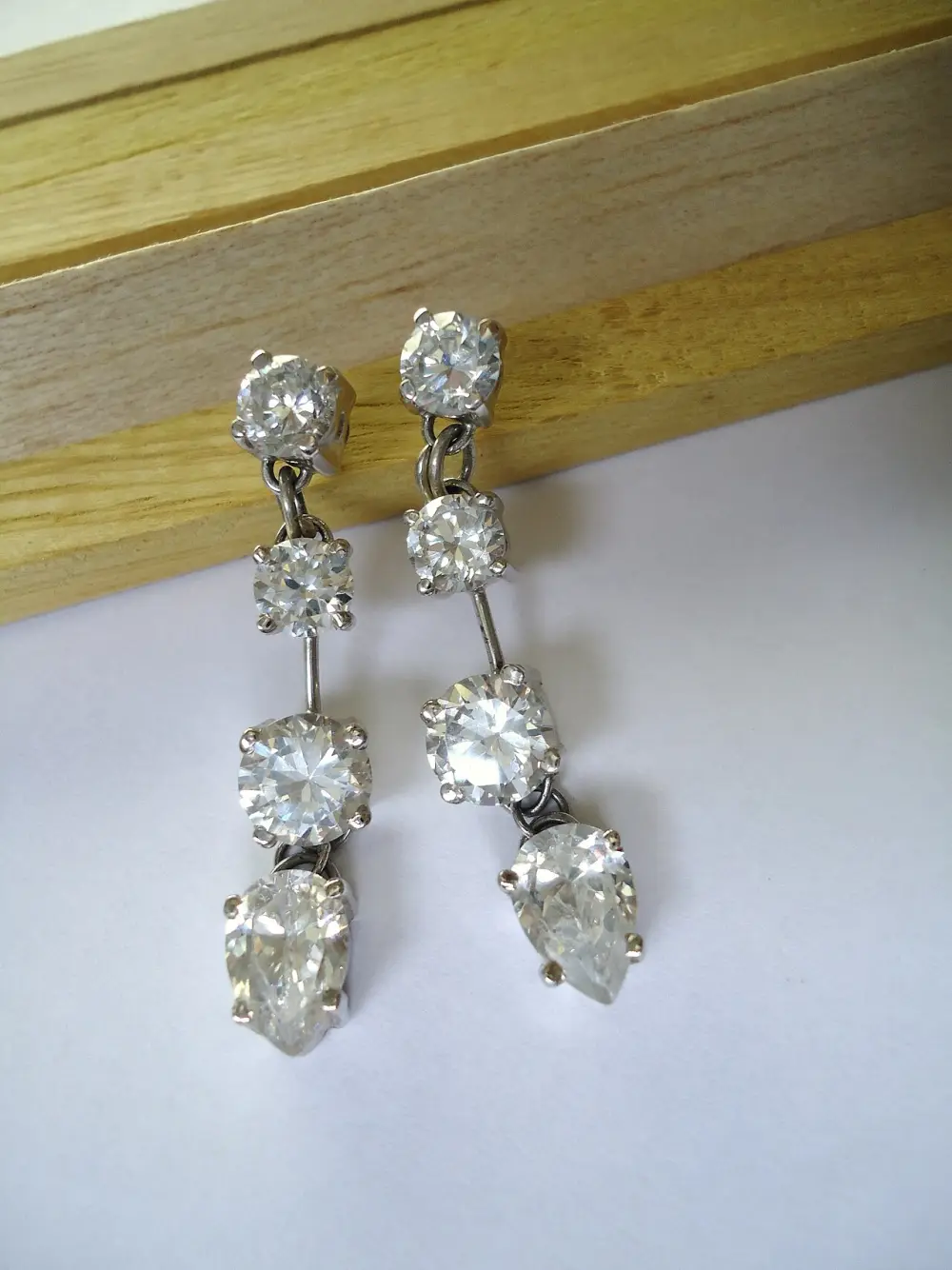 A pair of diamond drop earrings in white gold